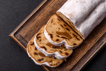 Christmas Stollen, a German sweet cake with marzipan and fruit. Winter Christmas Stollen