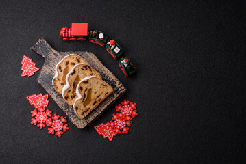 Christmas Stollen, a German sweet cake with marzipan and fruit. Winter Christmas Stollen