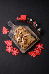 Christmas Stollen, a German sweet cake with marzipan and fruit. Winter Christmas Stollen