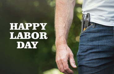 Happy Labor Day. Handsome man holding American Flag. Closeup, outdoors. Congratulations for family, loved ones, friends and colleagues. Concept of preparation for the national holiday