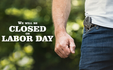 Signboard with the inscription We will be closed on Labor Day. Congratulations for family, loved...