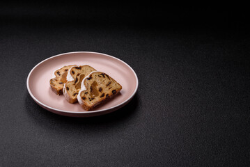 Christmas Stollen, a German sweet cake with marzipan and fruit. Winter Christmas Stollen