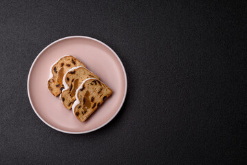 Christmas Stollen, a German sweet cake with marzipan and fruit. Winter Christmas Stollen