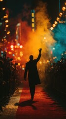 Crowd eagerly awaits celebrity arrival on a vibrant red carpet at night amid colorful smoke