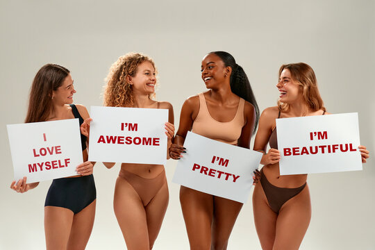 Diverse women holding self-love signs promoting body positivity and confidence