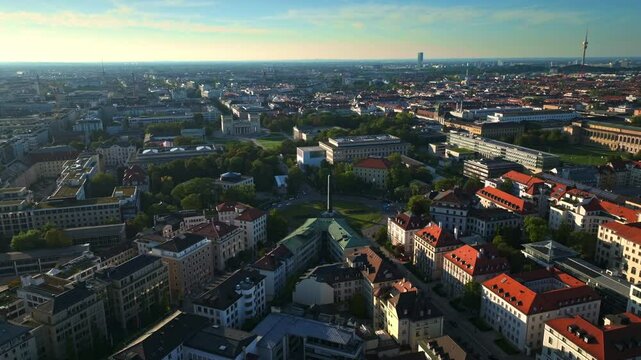 Aerial drone view of the Obelisk of King Ludwig I on Karolinenplatz in Munich, Germany, a historic war memorial surrounded by a circular plaza and neoclassical architecture.. 30 September 2024.