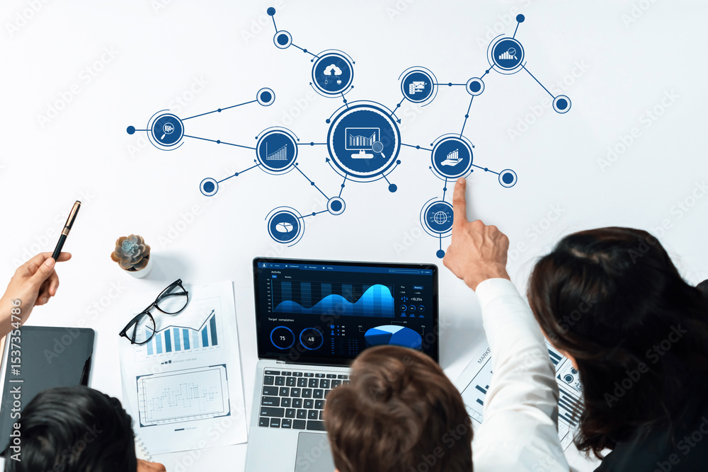 Poster A top-down view of professionals analyzing data on a laptop in a modern workspace. Graphs and charts illustrate key metrics for business growth and strategy. Amity