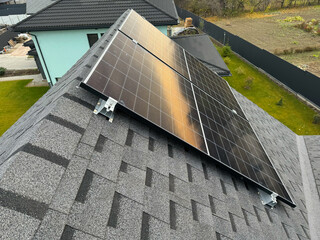 Solar panels for residential use installed on the roof of a house.