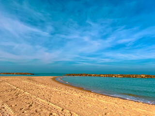 Sandy beach with beautiful clean sea. Warm Mediterranean sea with light waves. Paradise place for relaxation, vacation, tourism. Lonely sandy beach with beautiful waves. Beach of Israel, Ashkelon.
