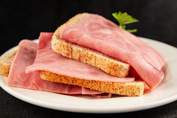 Ham slices meat spam pork fresh delicious gourmet food background on the table rustic food top view copy space