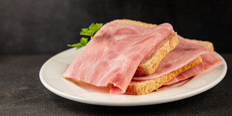 Ham slices meat spam pork fresh delicious gourmet food background on the table rustic food top view copy space