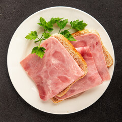 Ham slices meat spam pork fresh delicious gourmet food background on the table rustic food top view copy space