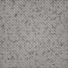 Seamless metal diamond plate texture with scratched, industrial steel surface. Realistic repeating background ideal for construction, machinery, manufacturing, and 3D design.