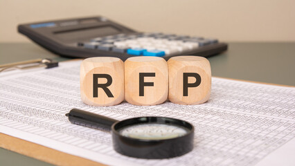RFP wooden blocks on financial spreadsheet background