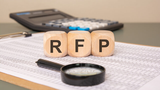 RFP wooden blocks on financial spreadsheet background