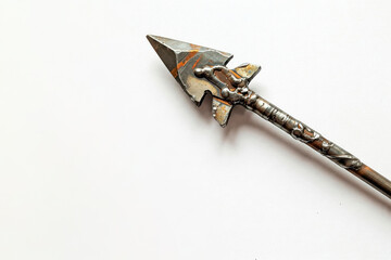 A rusty arrow with traces of welding on a white background. Space for text.
