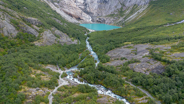 Drone View Over River and Glacier Lake at Briksdalen