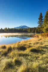 Obraz premium Serene mountain lake scene at dawn.
