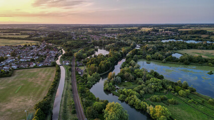 Fototapeta premium Aerial view of Hoddesdon, Hertfordshire showing river, sunset and housing estate