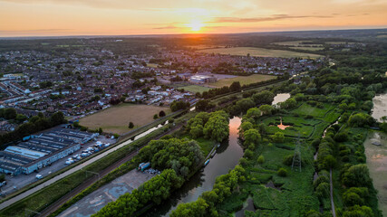 Fototapeta premium Aerial view of Hoddesdon, Hertfordshire showing river, sunset and housing estate