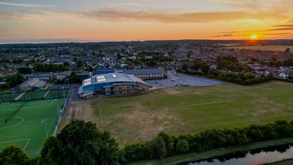 Aerial view of Hoddesdon, Hertfordshire showing river, sunset and housing estate