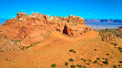 Aerial Vermilion Cliffs Red Rock Formation and Desert Valley Fly Over
