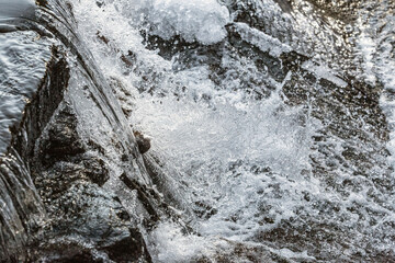 Water and ice in a small waterfall in central Connecticut.
