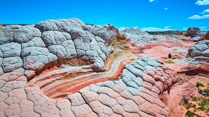 Aerial White Pocket Sandstone Domes and Swirling Layers Motion View