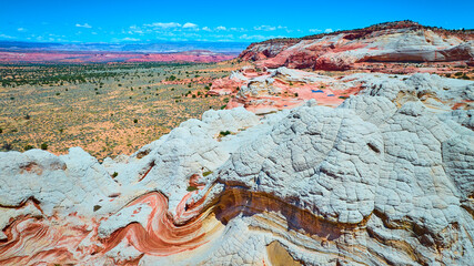 Aerial Red and White Swirling Sandstone Formations Marble Canyon Motion View