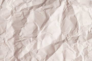 Wrinkled light beige paper surface
