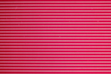 Horizontal red and pink striped paper background
