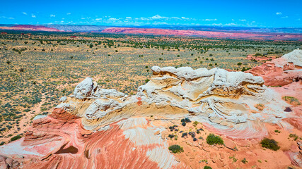 Aerial Fly Over White Pocket Sandstone Layers and Desert Plain Marble Canyon
