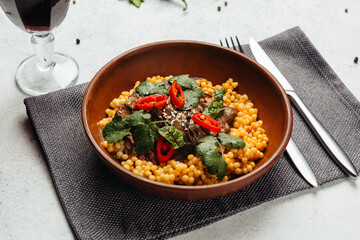 Georgian cuisine dish in a restaurant on a light background