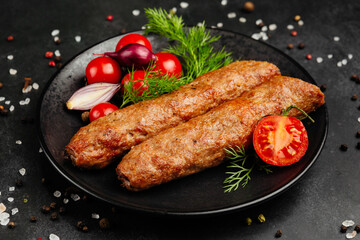 juicy golden grilled barbecue meat with spices on dark background