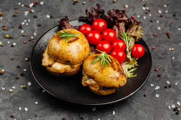 juicy golden grilled barbecue meat with spices on dark background
