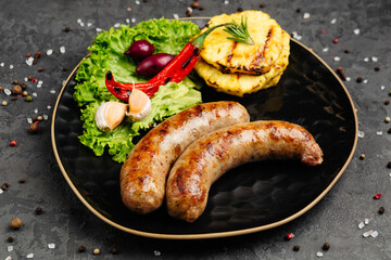 juicy golden grilled barbecue meat with spices on dark background