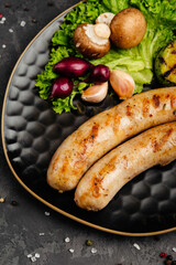 juicy golden grilled barbecue meat with spices on dark background