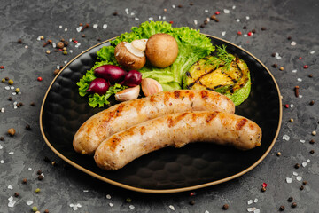 juicy golden grilled barbecue meat with spices on dark background