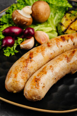 juicy golden grilled barbecue meat with spices on dark background