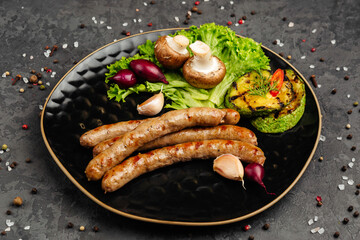 juicy golden grilled barbecue meat with spices on dark background