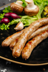 juicy golden grilled barbecue meat with spices on dark background