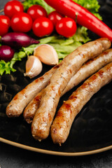 juicy golden grilled barbecue meat with spices on dark background