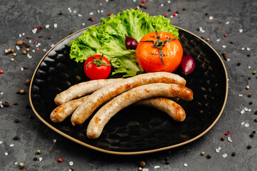 juicy golden grilled barbecue meat with spices on dark background