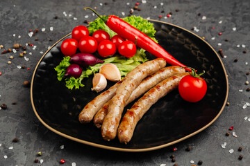 juicy golden grilled barbecue meat with spices on dark background