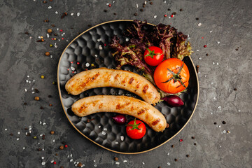 juicy golden grilled barbecue meat with spices on dark background