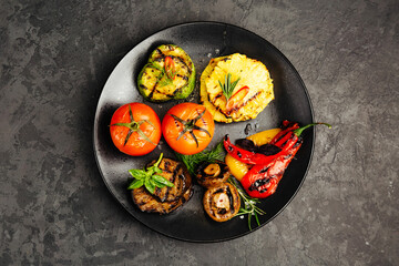 juicy golden grilled barbecue meat with spices on dark background