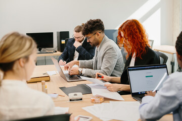 Business people working together on project in modern office