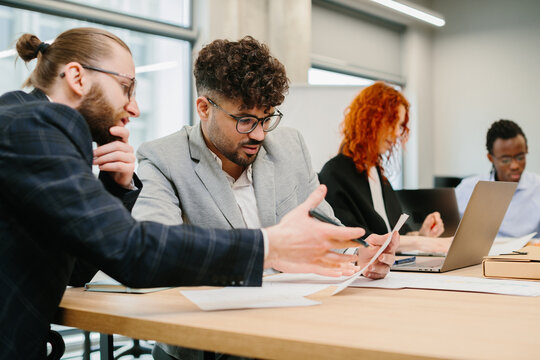 Business people working together on project in modern office