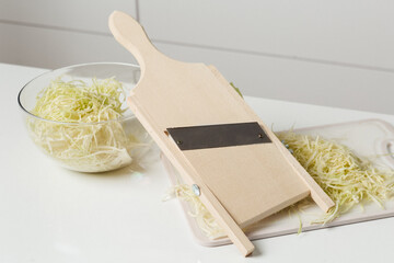 slicing cabbage with a shredder