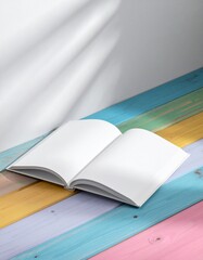 Open Blank Book on Colorful Wooden Surface